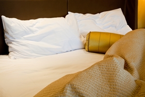 By leaving your bed messy, you'll help rid it of dust mites.